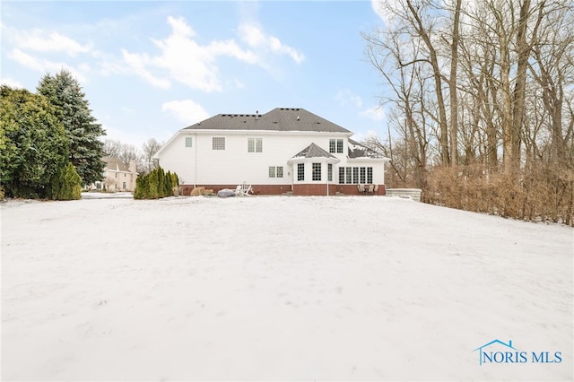 view of snow covered property