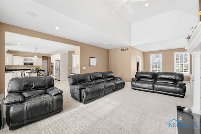 living area featuring recessed lighting, light carpet, ceiling fan, baseboards, and visible vents