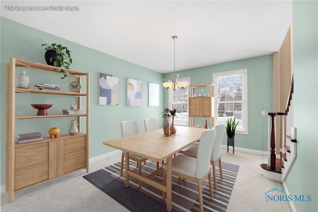 dining space featuring light carpet, baseboards, an inviting chandelier, and stairs