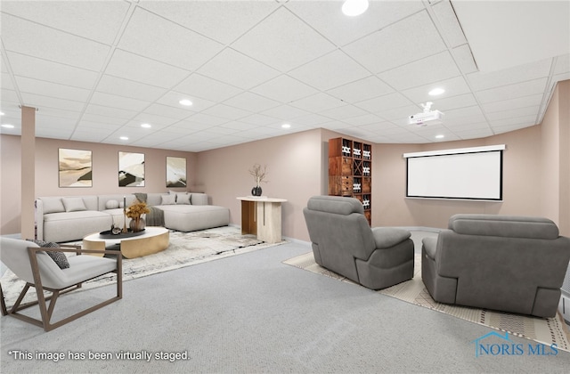 living area featuring recessed lighting, light colored carpet, and a drop ceiling