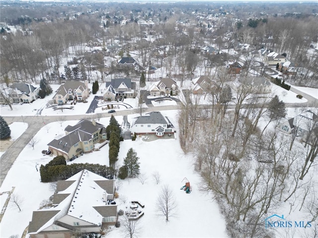 snowy aerial view with a residential view