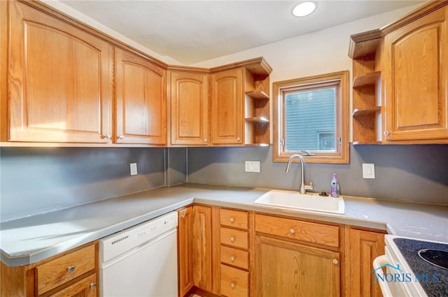 kitchen with white appliances, brown cabinets, light countertops, open shelves, and a sink