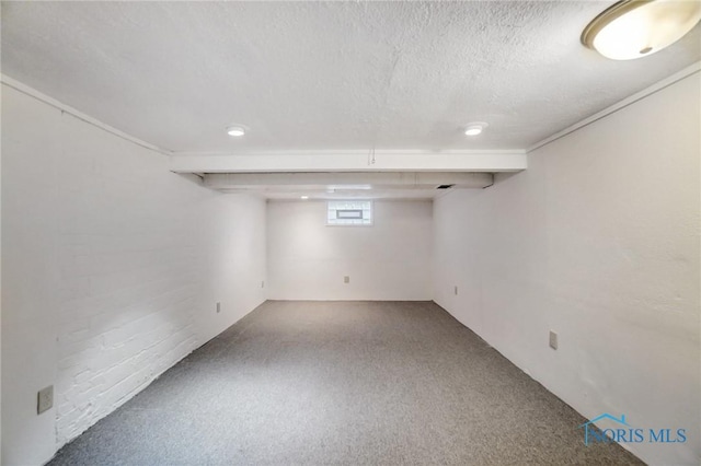 basement with a textured ceiling