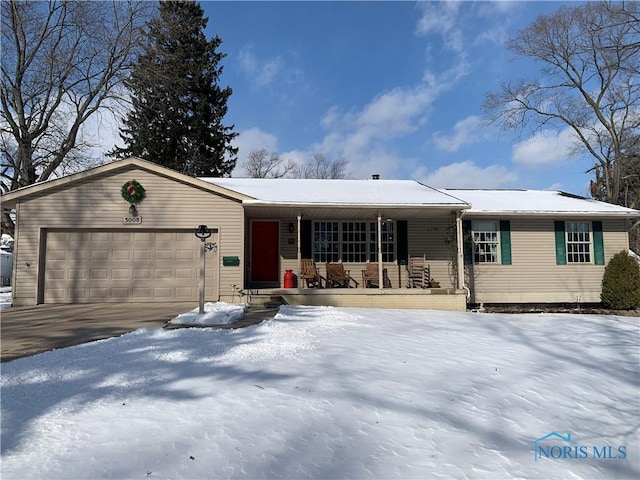 ranch-style house with a porch and an attached garage