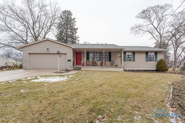 single story home featuring a porch, a front yard, driveway, and an attached garage