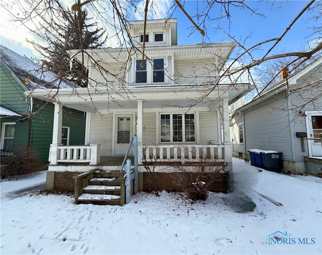 traditional style home featuring a porch