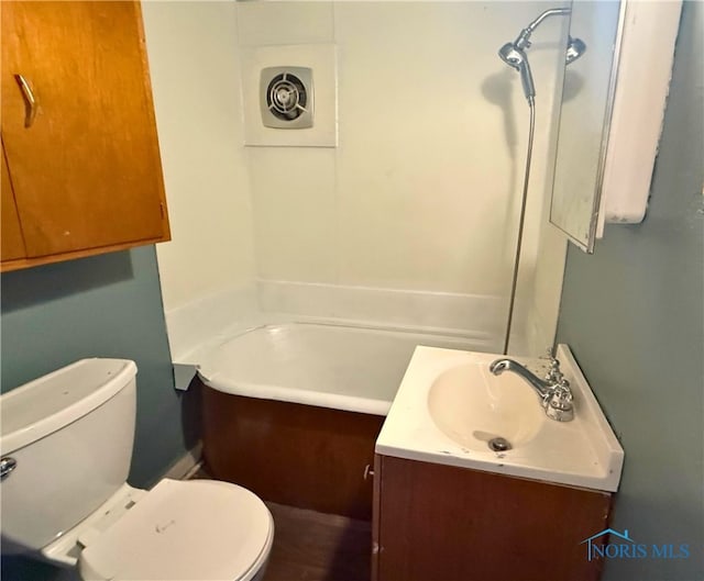 full bath with a tub, vanity, and toilet