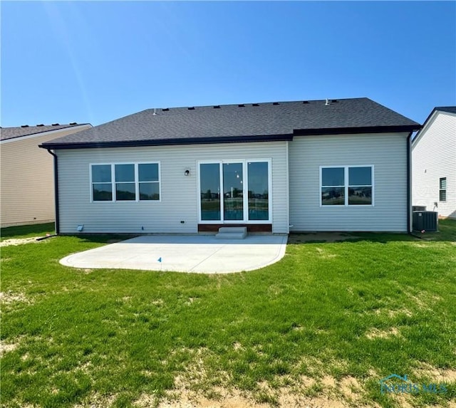 1244 Dublin Dr, Waterville, OH 43566 - back of house featuring a patio, central AC unit, a lawn, and roof with shingles