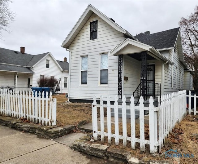 bungalow with a fenced front yard