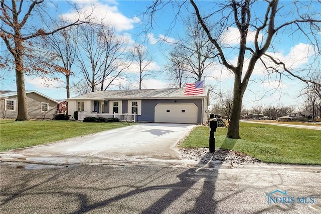 ranch-style home with a garage, driveway, a porch, and a front yard