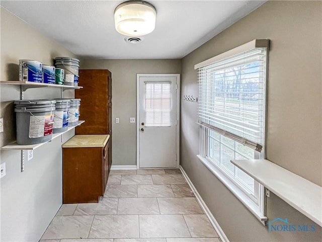 entryway with visible vents and baseboards