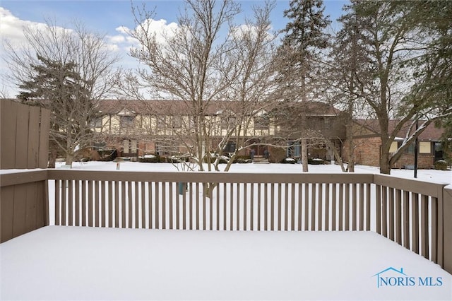 view of snow covered deck