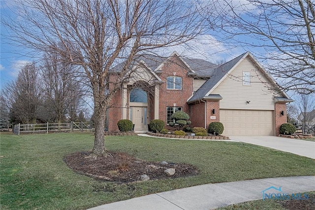 traditional-style house with a garage, concrete driveway, fence, a front lawn, and brick siding