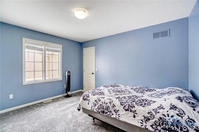 bedroom featuring carpet flooring, visible vents, and baseboards