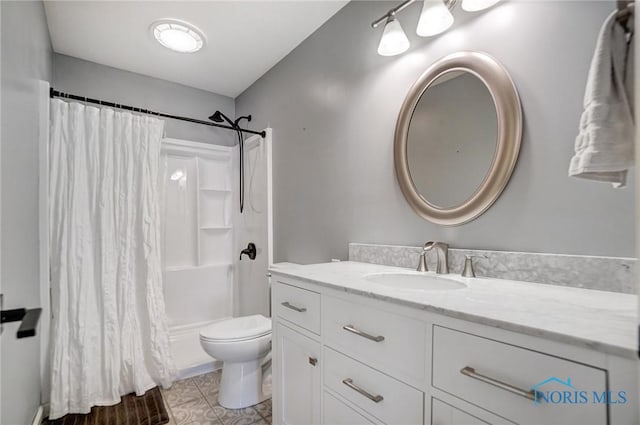 bathroom featuring shower / tub combo, vanity, and toilet