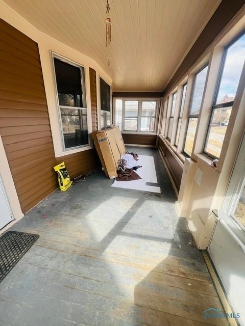 sunroom with wood ceiling