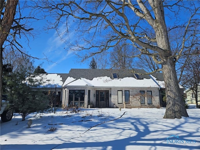 view of front of property featuring brick siding