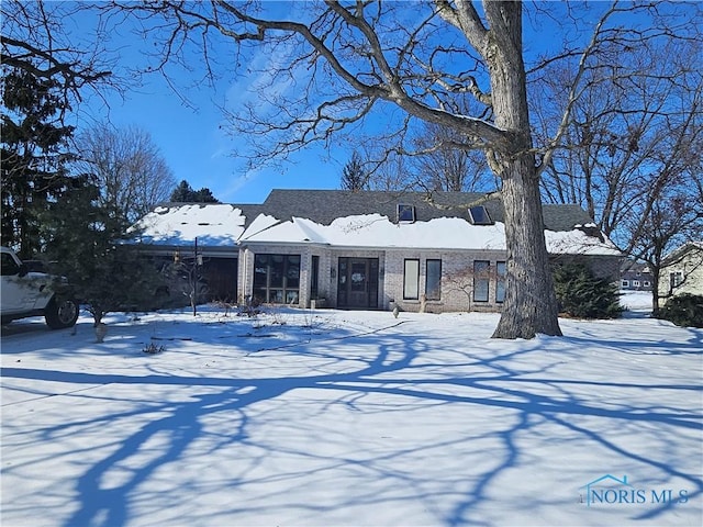 view of front of house featuring brick siding