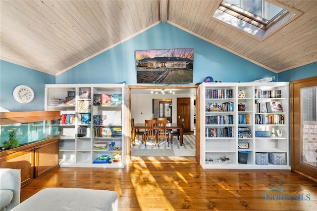 sitting room with lofted ceiling with skylight, wood ceiling, crown molding, and hardwood / wood-style floors