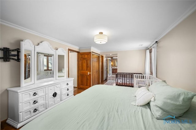 bedroom with ornamental molding