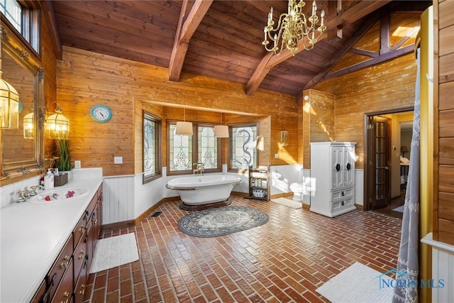 bathroom featuring brick floor, wood walls, wood ceiling, and a freestanding tub