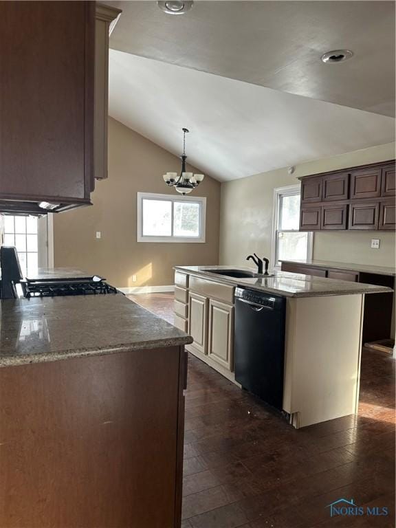 kitchen with plenty of natural light, lofted ceiling, dishwasher, and a sink