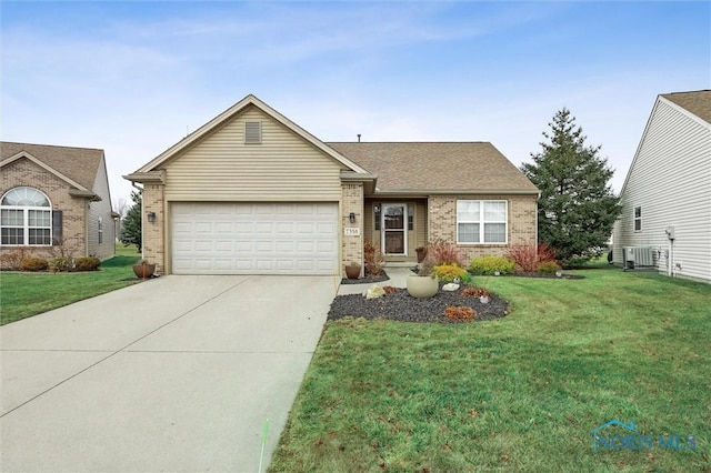 ranch-style home with brick siding, central air condition unit, concrete driveway, a front yard, and a garage