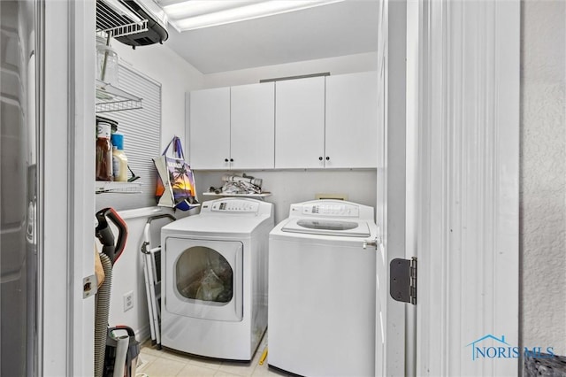 laundry room with cabinet space and washer and dryer