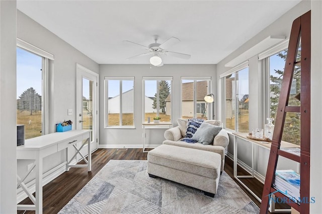 sunroom / solarium with a ceiling fan and a wealth of natural light