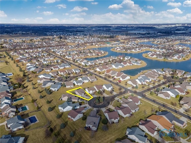 birds eye view of property featuring a residential view and a water view