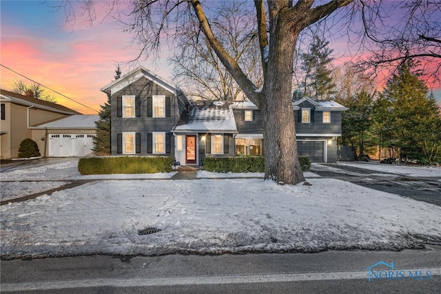 traditional-style house featuring driveway