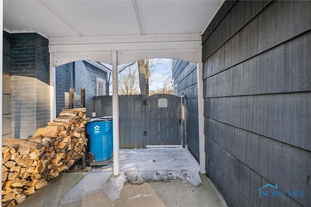 view of patio / terrace featuring fence and a gate