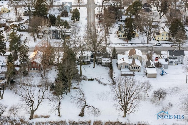 snowy aerial view with a residential view