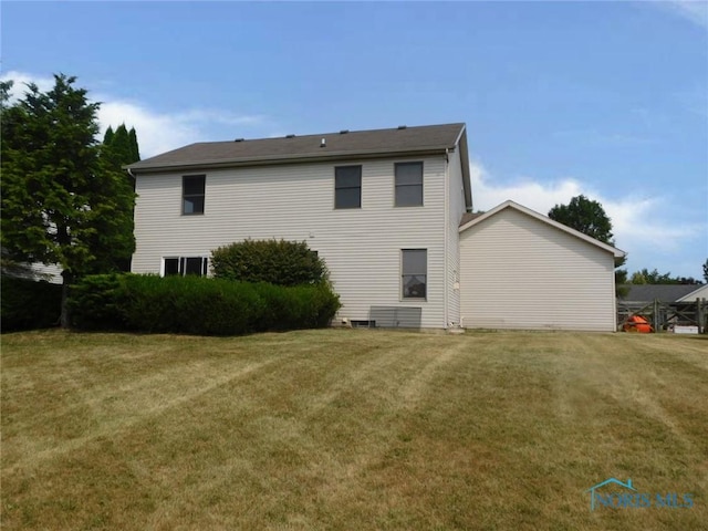 back of house featuring a yard