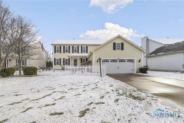 view of front of property featuring a garage and driveway