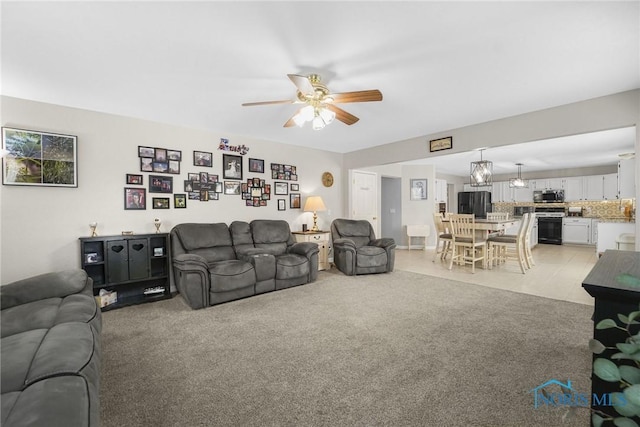 living room with light colored carpet and ceiling fan