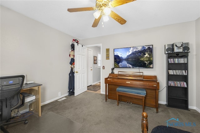 sitting room with ceiling fan, carpet floors, visible vents, and baseboards