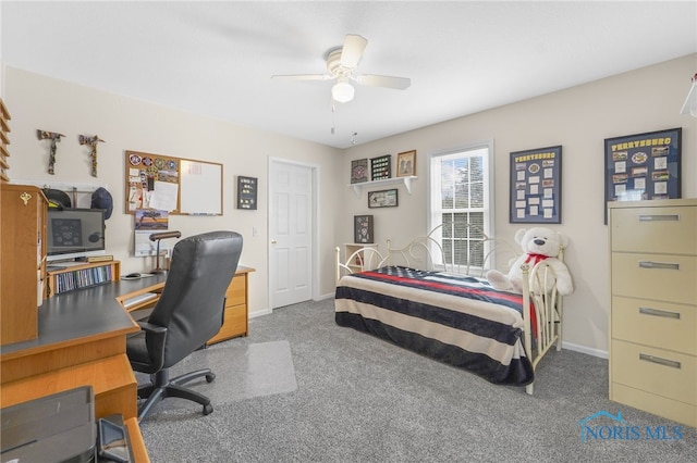 carpeted bedroom featuring ceiling fan and baseboards