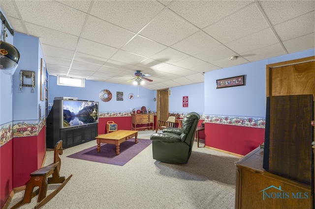 rec room with a paneled ceiling and carpet