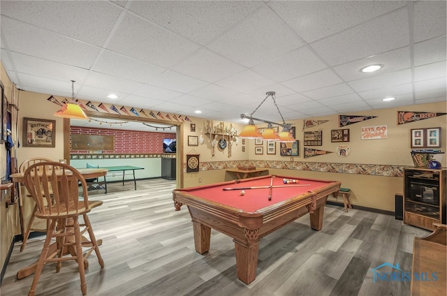 rec room with recessed lighting, pool table, wood finished floors, a drop ceiling, and baseboards