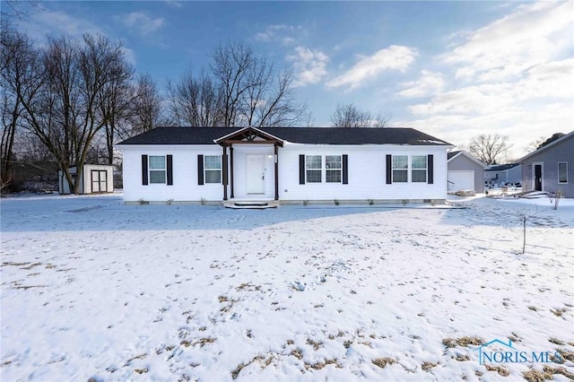 20391 Brown Ln, Weston, OH 43569 - ranch-style house featuring a garage, an outdoor structure, and a storage shed