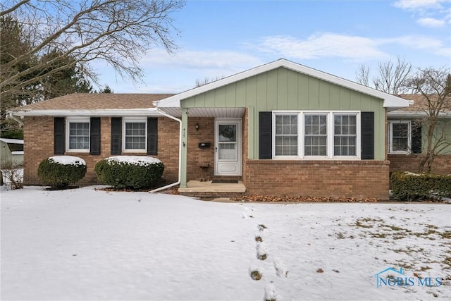 ranch-style house with brick siding