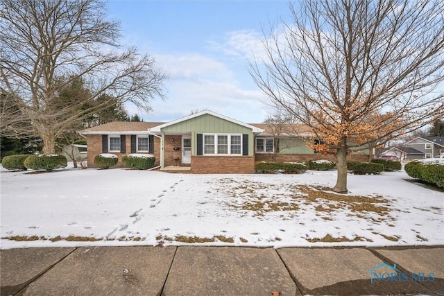 view of front of property featuring brick siding