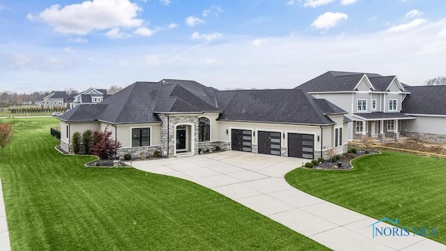 view of front of home featuring an attached garage, concrete driveway, stone siding, stucco siding, and a front lawn