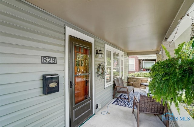 property entrance with covered porch