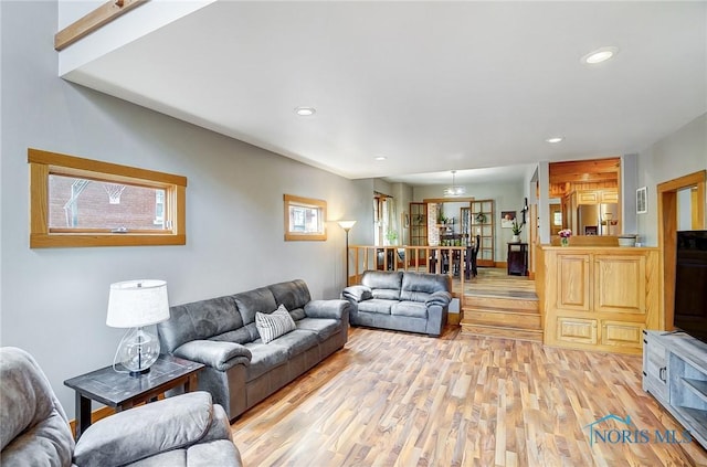 living room featuring recessed lighting and light wood-style floors