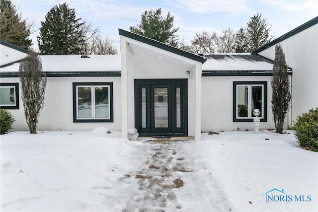 mid-century modern home with stucco siding