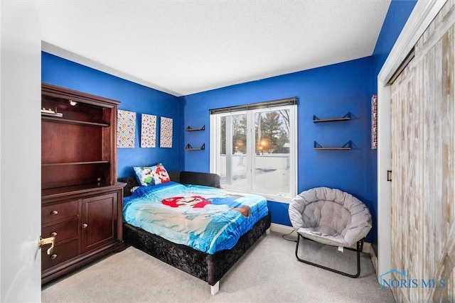 bedroom featuring light colored carpet