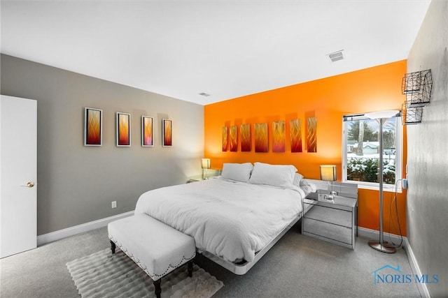 bedroom featuring visible vents and baseboards