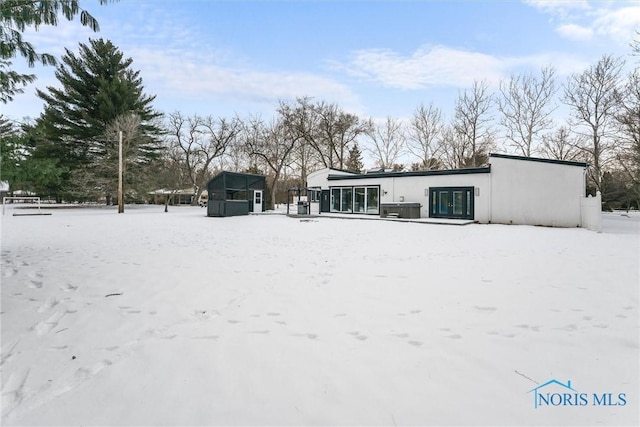 view of snow covered house